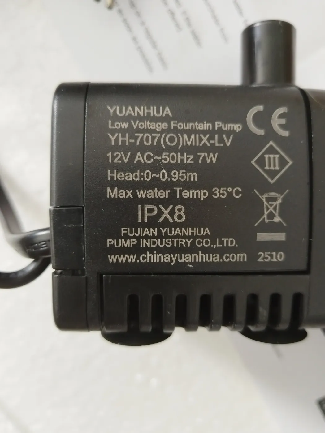 Close-up inspection of the IPX8 low-voltage pump rating label