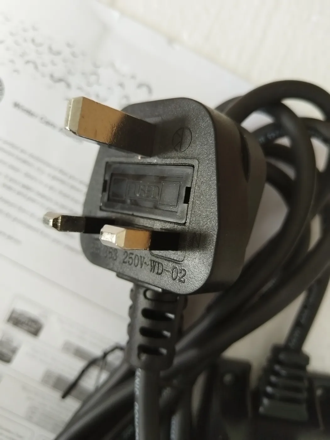 Close-up inspection of the fused UK plug
