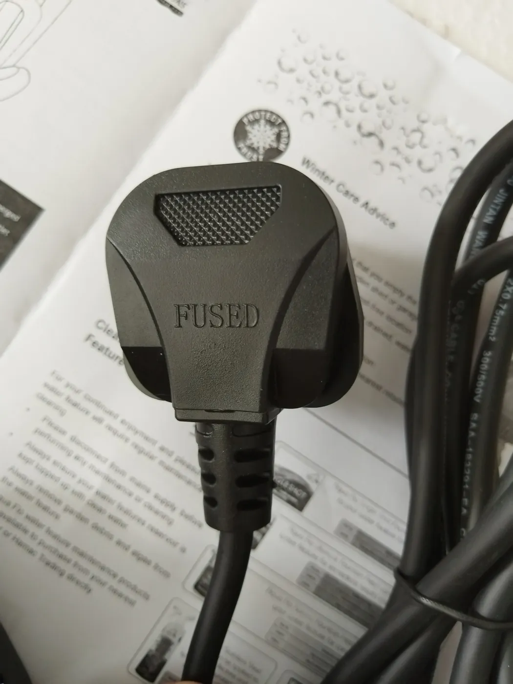Rear view of the fused UK plug and power cable